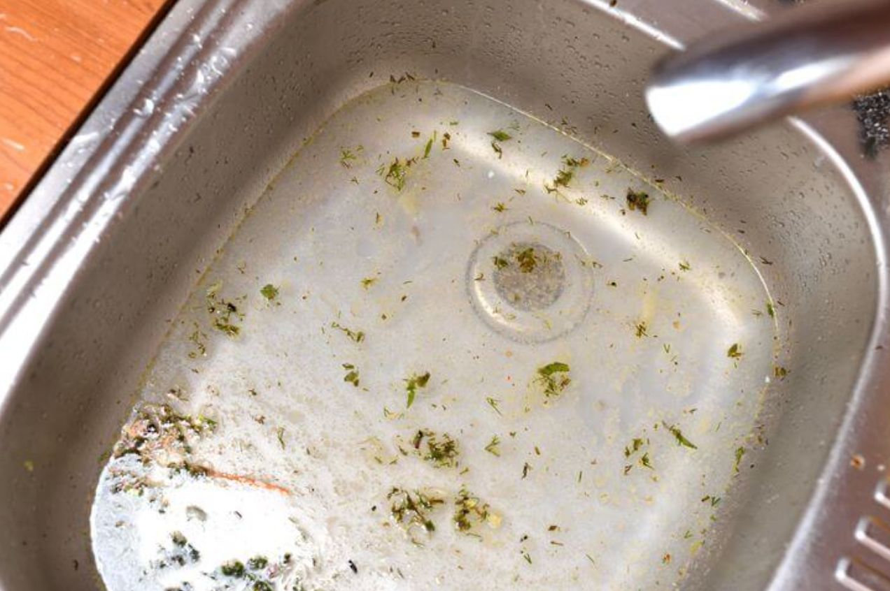 a kitchen sink full of water and debris from septic tank back up in the middle of a vernon bc winter